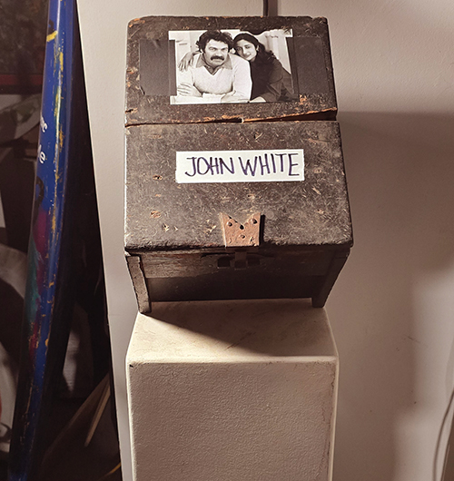 Box holding the ashes of performance artist John M. White at Art City in Ventura, 2025